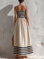 Ortensia — Vestido largo de rayas negras y beige con tirantes finos.