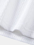 Set – elegantní geometrický jacquard polo a slim kalhoty