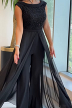 Černý galavečerní jumpsuit s překrytou šifonovou sukní